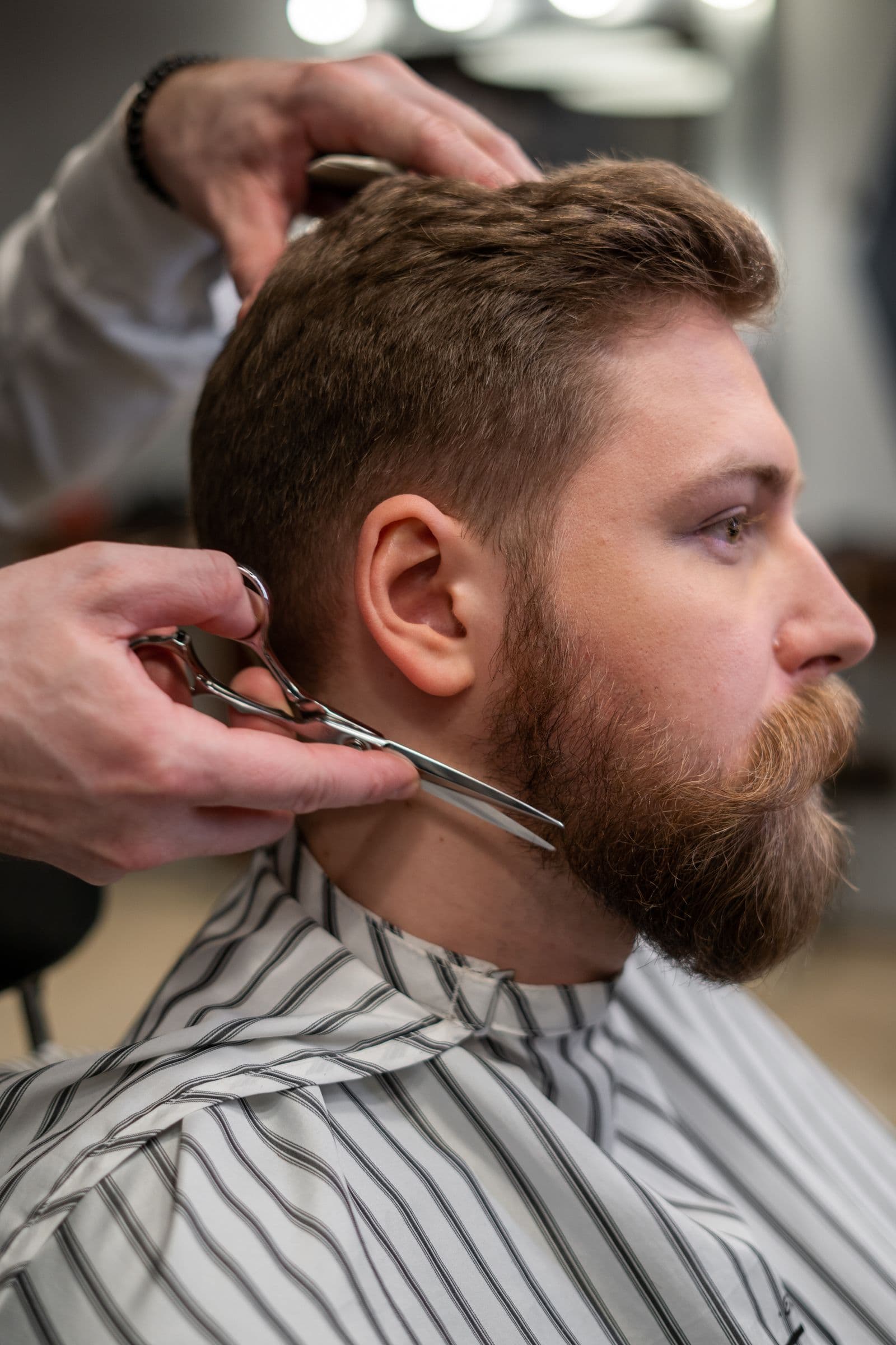 Barber serving a client — bookable in Reserveo